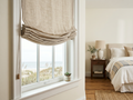 Hobbled Roman Shade in Coastal Sand installed on a sunlit window in a Bay Area home, cotton-linen blend